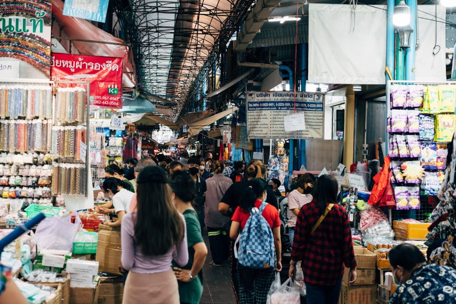 Chatuchak Weekend Market, the world's largest weekend market, packed aisles and shoppers on a Saturday morning