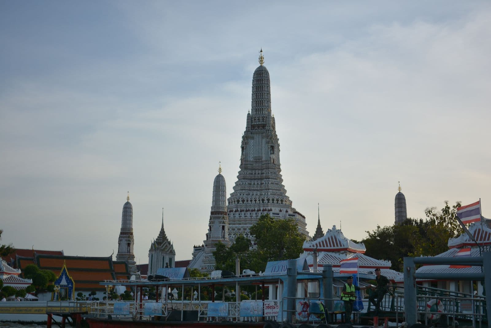 The central prang of Wat Arun at dusk, seen from across the Chao Phraya River