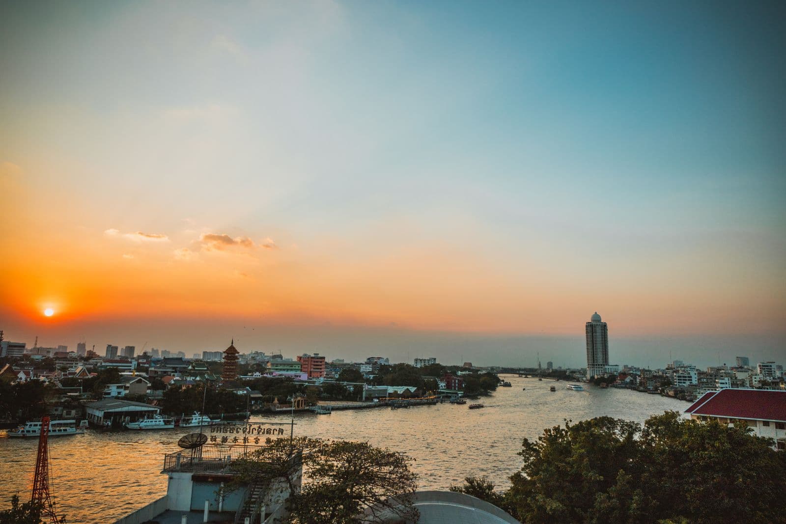 The Chao Phraya River and riverside skyline at sunset