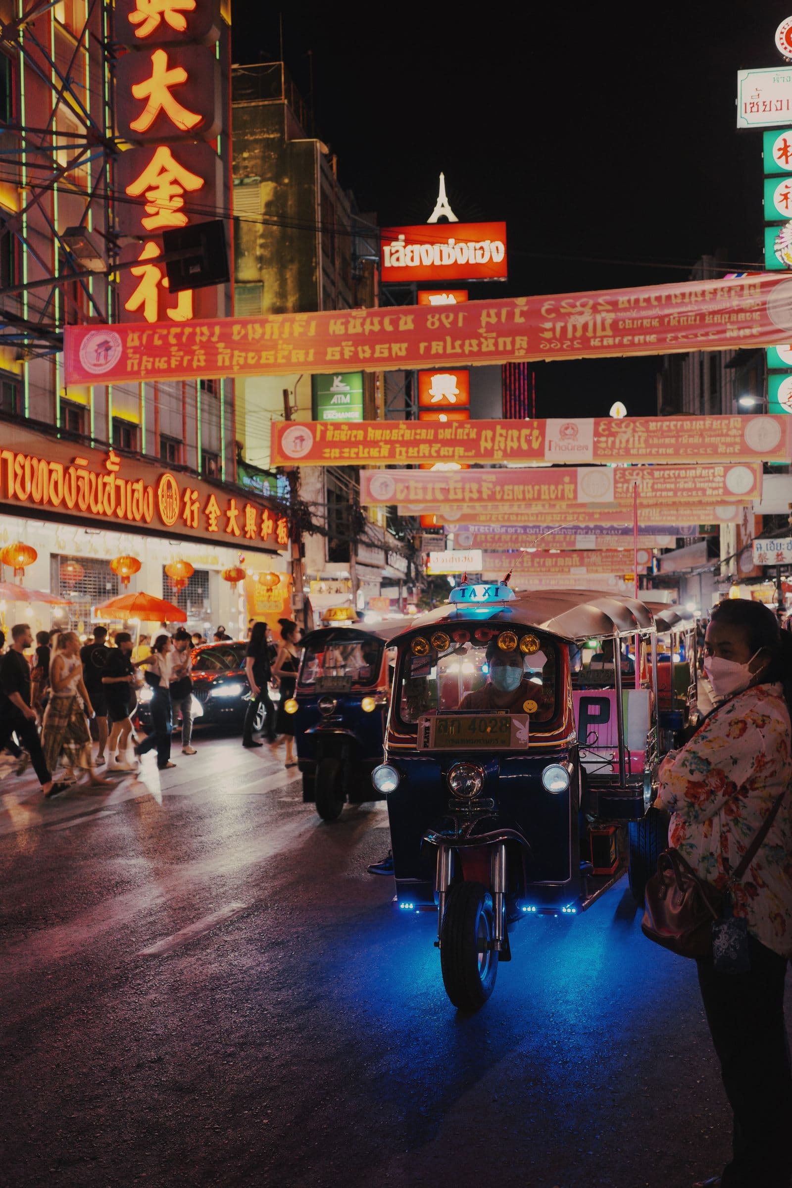 A tuk-tuk passing through Yaowarat at night