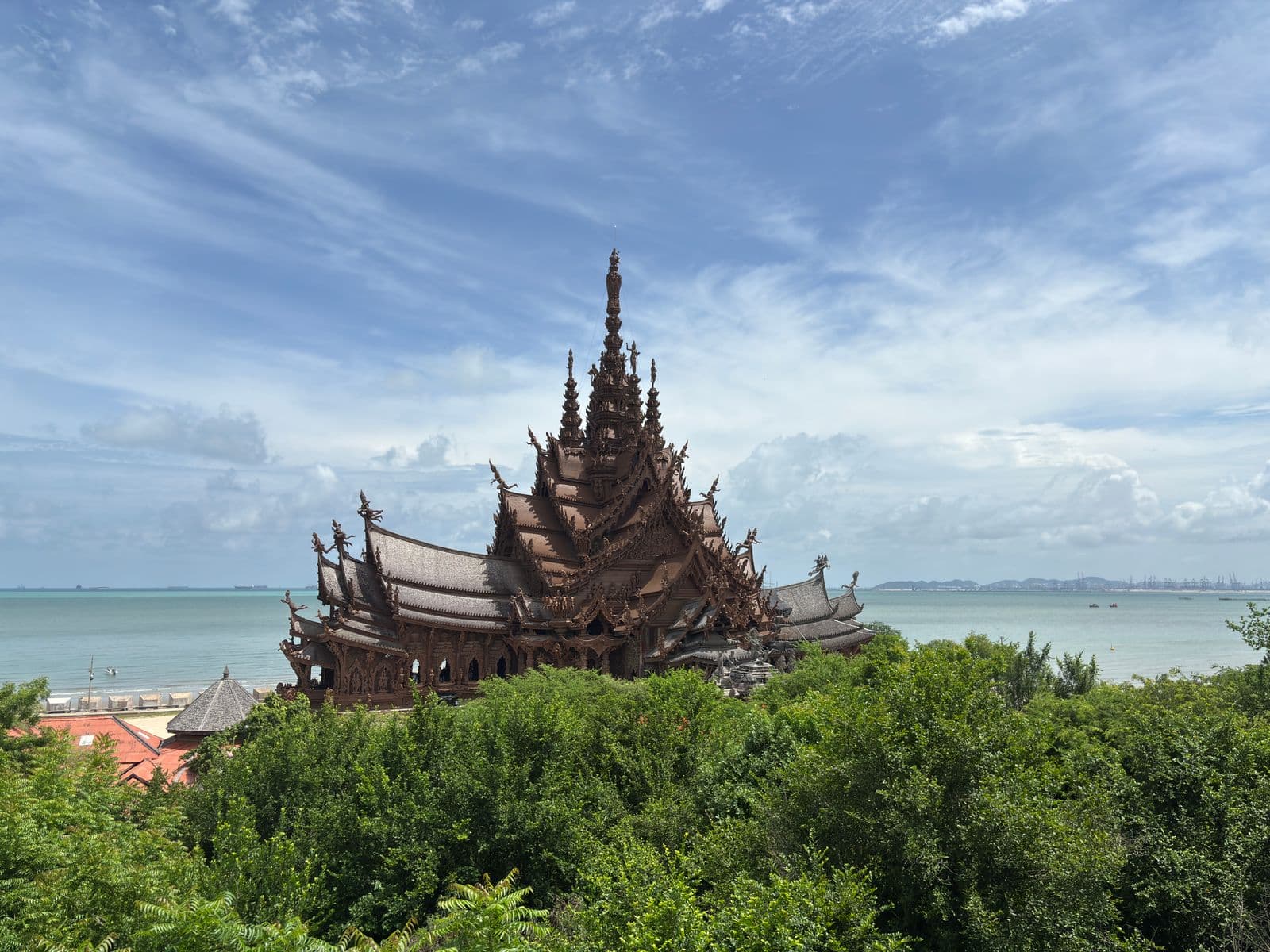 The wooden Sanctuary of Truth in Pattaya against the sea