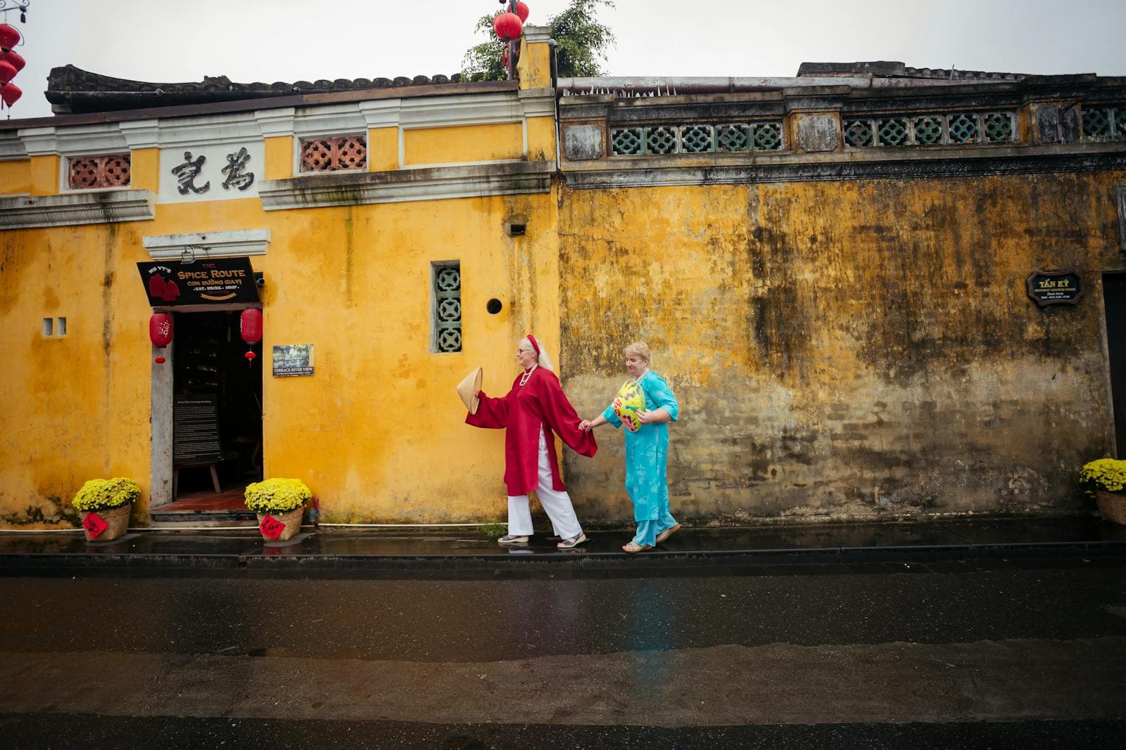 Hoi An old town, UNESCO World Heritage, 600 years of Vietnamese trading port history. Yellow walls and ao dai in the ancient lanes.
