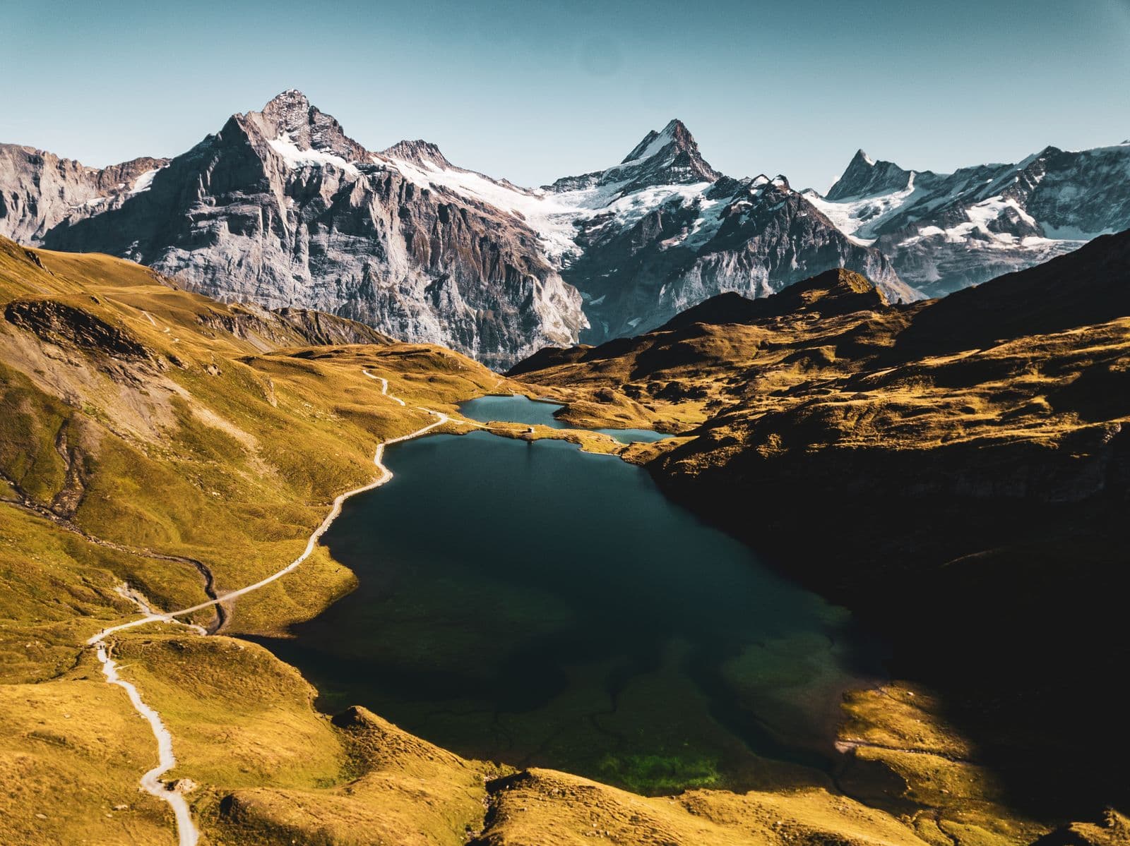 Bachalpsee lake reached on foot from First, with Alpine peaks behind