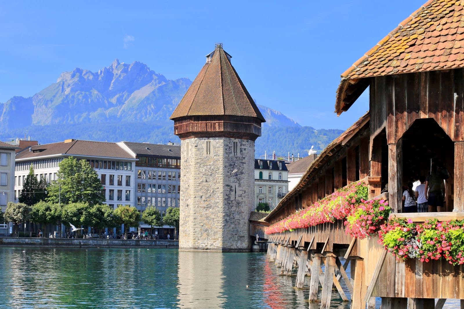 Lucerne's Chapel Bridge and Water Tower with Mount Pilatus behind