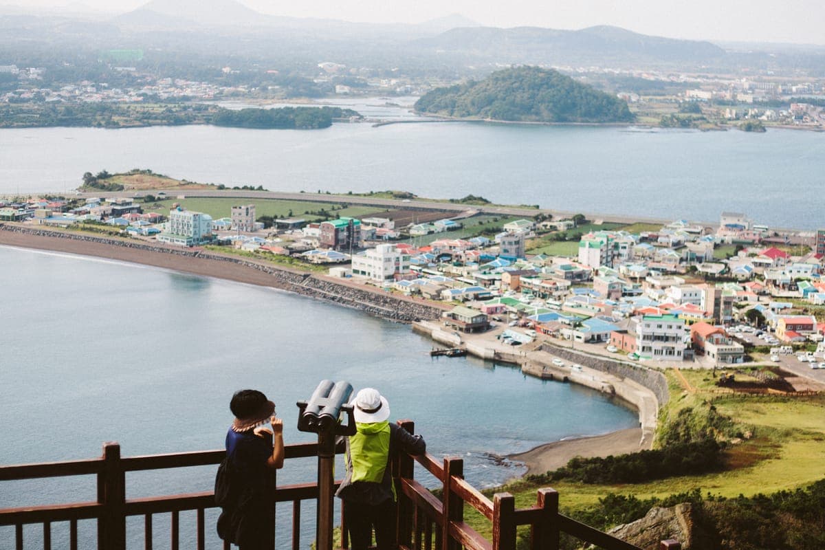 View from Seongsan Ilchulbong summit, looking down over Seongsan town, the harbor, and surrounding sea