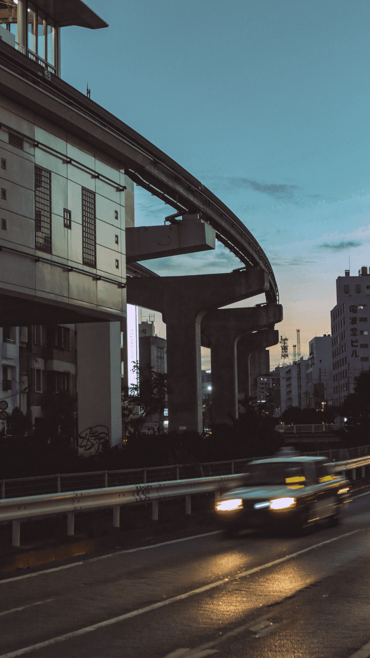 Yui Rail elevated track and a station over the Naha cityscape in the evening
