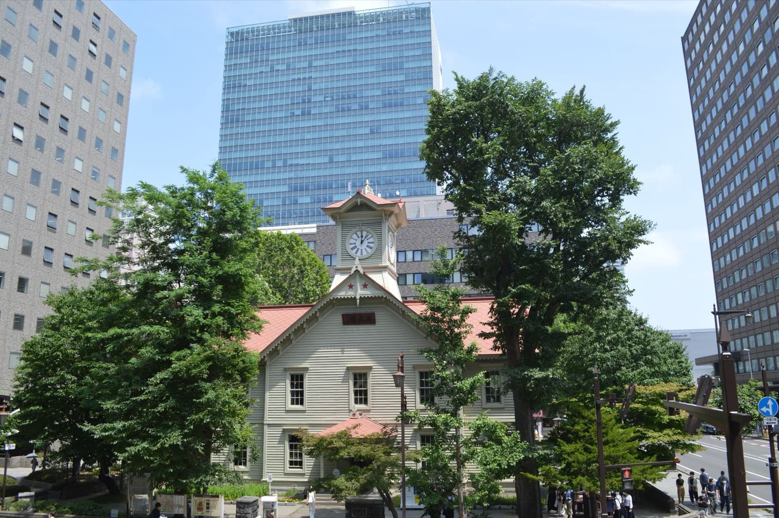 The Sapporo Clock Tower framed by office buildings