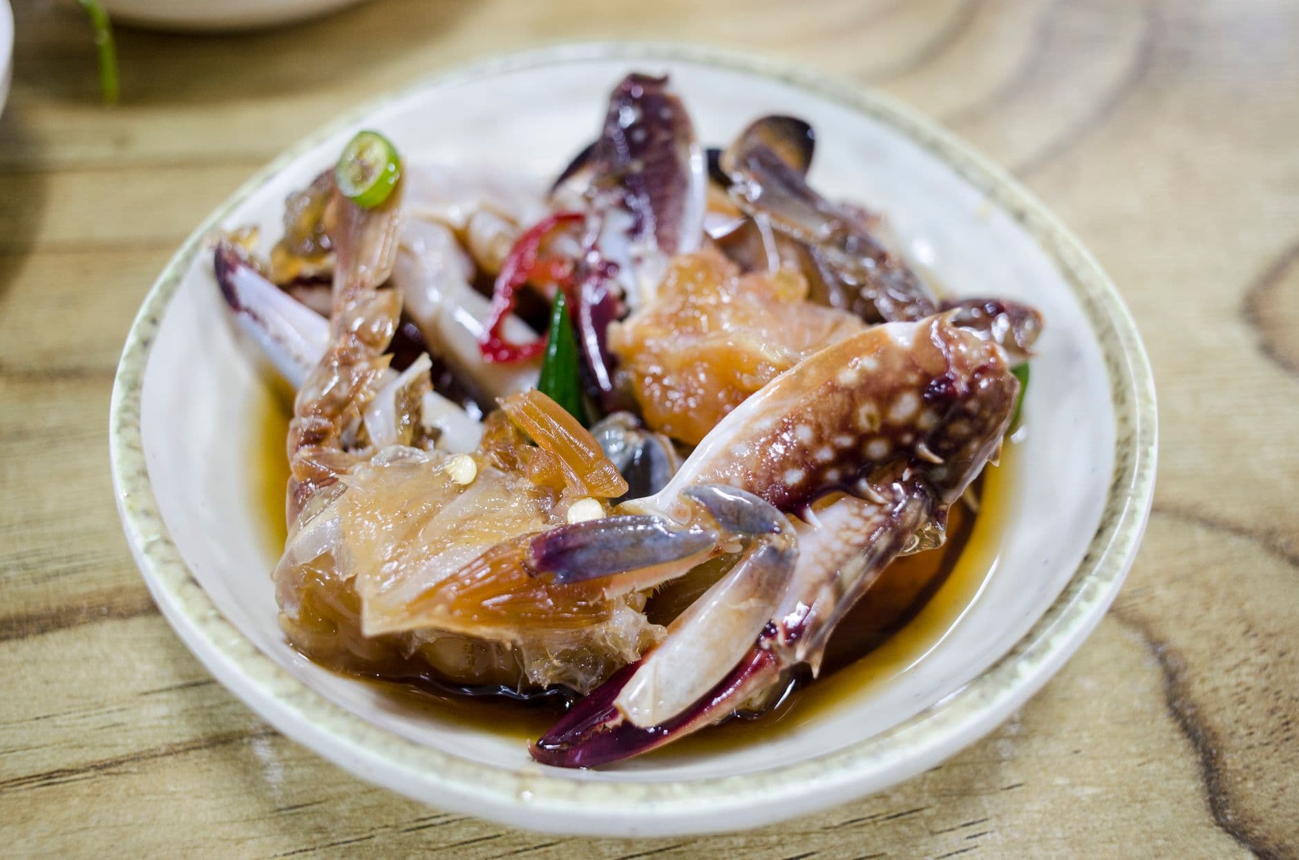 A spread of ganjang gejang, raw crab marinated in soy sauce