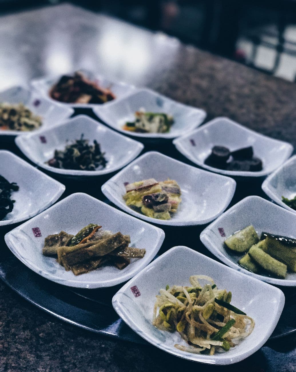 A Korean meal served with an array of banchan side dishes