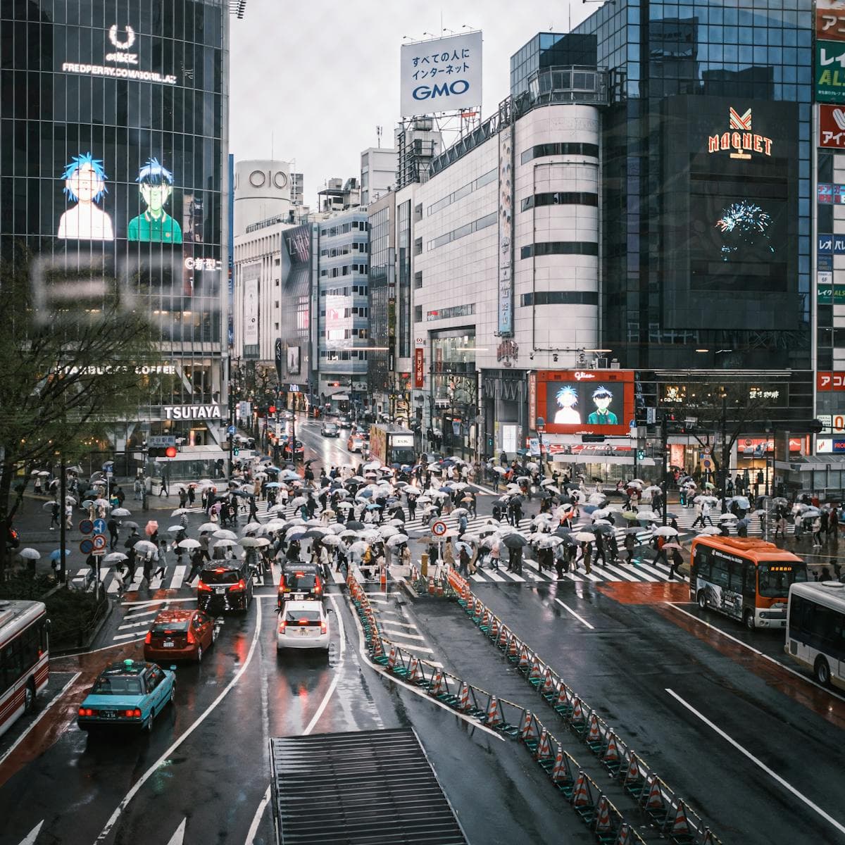 Shibuya Scramble Crossing on a rainy day, white umbrellas and taxis turning Tokyo's most famous intersection into a living painting